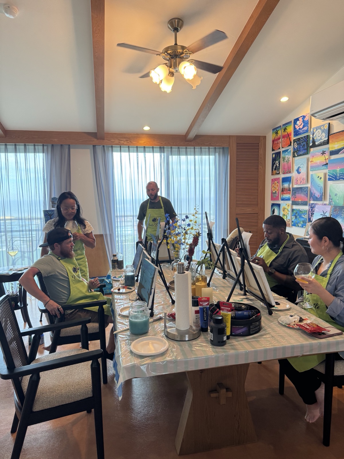 Pinto Beetle private session guests painting together around the studio table