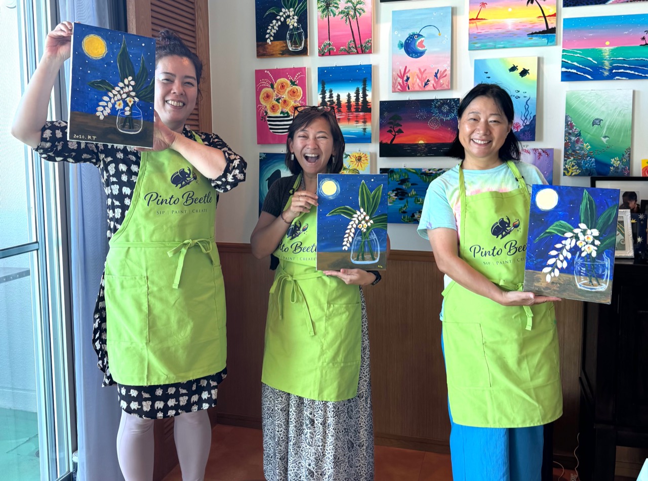 Three Pinto Beetle guests smiling with their finished moonlit getto paintings