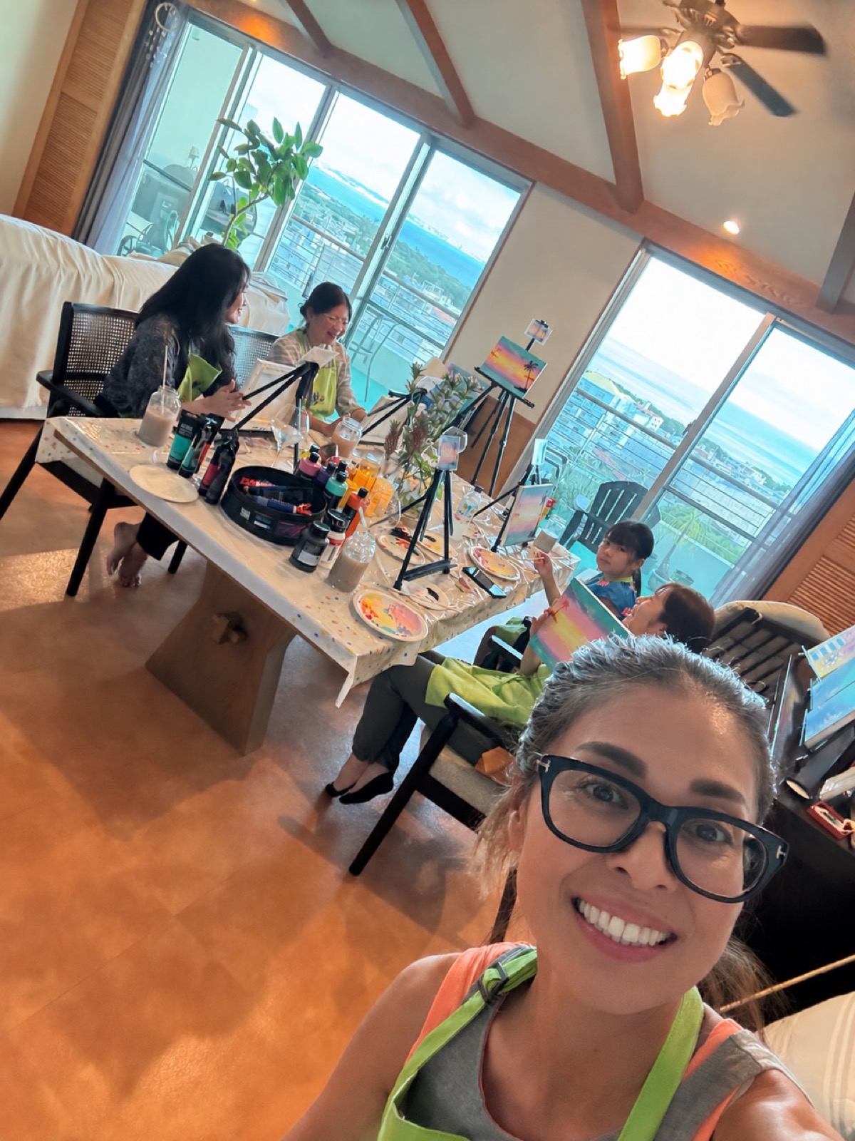 Pinto Beetle guests painting together during a Sunset Paradise class selfie