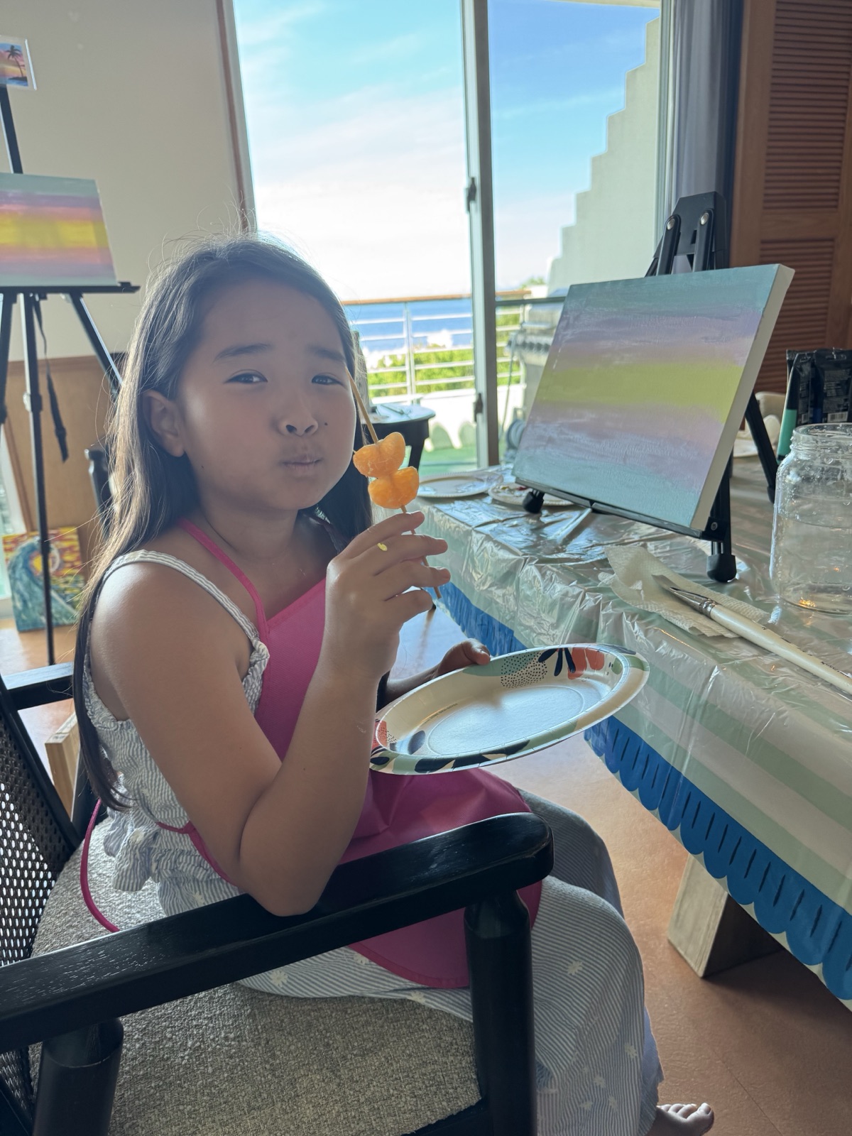 Young Pinto Beetle guest enjoying a snack break beside her painting