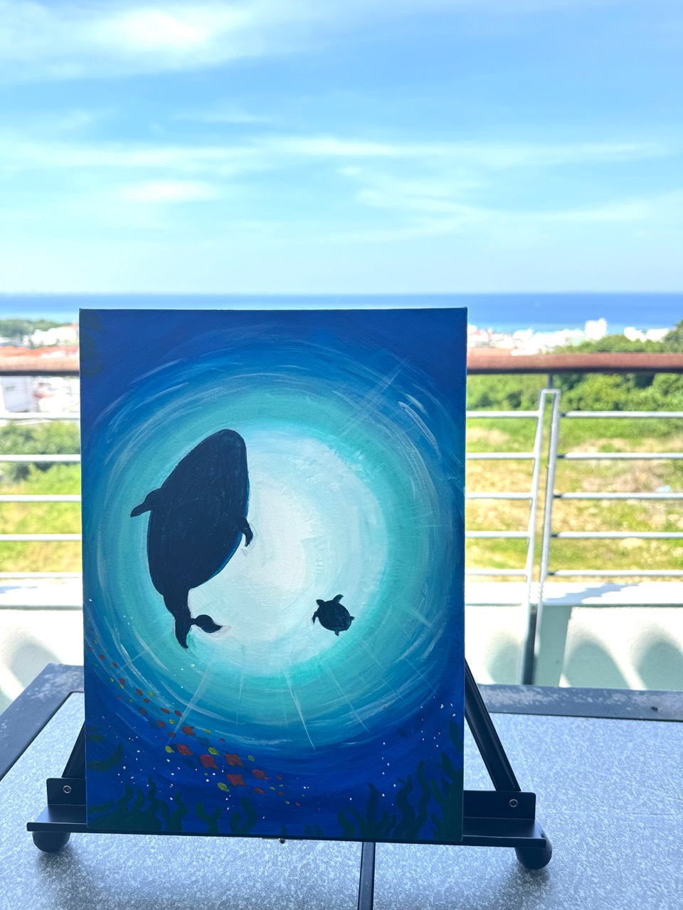 Ocean glow painting with whale and sea turtle silhouettes